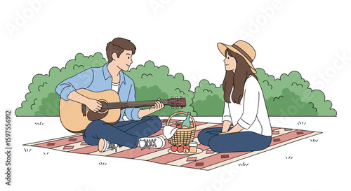 Young couple enjoying romantic picnic together playing guitar and singing outdoors on a sunny day
