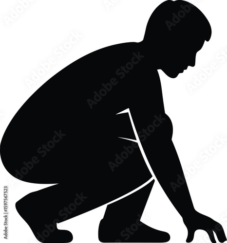 Silhouette of a man squatting