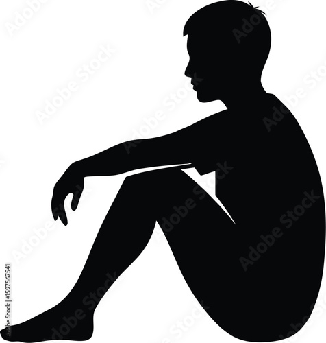 Silhouette of a man sitting alone