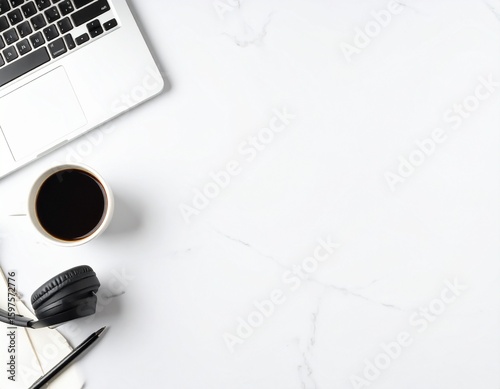 Online Education Concept with Laptop, Headphones, Notebook, and Coffee on Clean Desk
