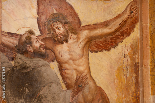 PIACENZA, ITALY - MAY 20, 2025: The fresco of stigmatisation of St. Francis of Assisi in church Basilica di San Francesco by unknown artist. 