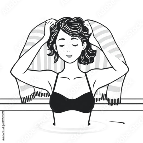 A swimmer drying her hair under striped towels by the pool