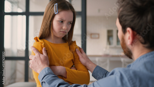 Cuadro en lienzo Stressed Caucasian family argument guilty man father male calming down touch angry little girl offended child daughter kid being stubborn at home