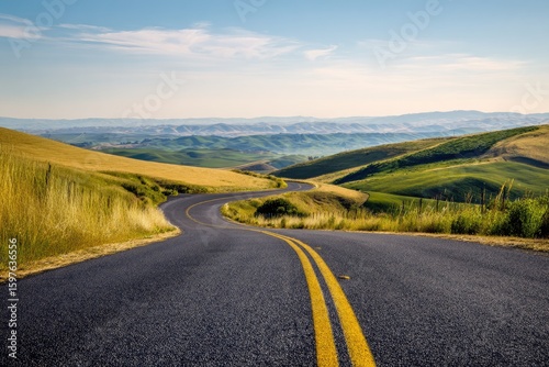 Winding road through golden hills