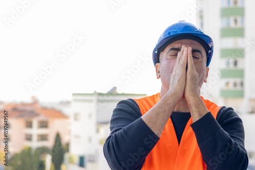 Tired and exhausted mechanical technician or building contractor. Bad news triggering headache