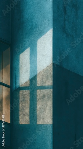 Modern building facade in warm evening light, soft shadows falling across textured teal walls, Transformative Teal color