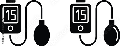 Two black sphygmomanometers with digital displays and inflation bulbs on white background