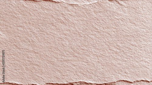 Close-up of torn kraft paper with rough edges. Natural beige texture ideal for backgrounds, eco design, scrapbooking, packaging, or handmade crafts
