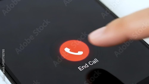 Finger pressing end call button on smartphone screen