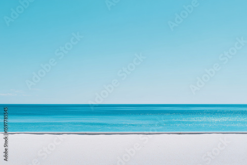 calm sea horizon with clear blue sky and white sandy beach showing peaceful summer day