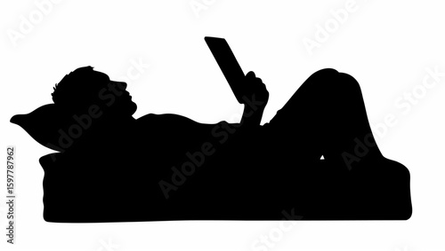 Silhouette of person lounging on couch while holding tablet with relaxed posture and focused attention span