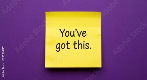 A vibrant yellow sticky note displays the encouraging message 