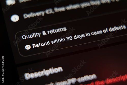 Closeup of a return policy on shopping app screen showing 30-day refund in case of defects.