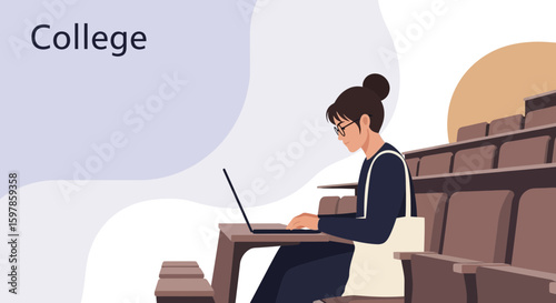 Focused Student Studying With Laptop in University Auditorium During Lecture