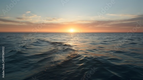 Ocean expanse meeting the horizon under the warm hues of the setting sun