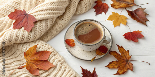Cozy Autumn Tea Break Flatlay: Warm Drink in Speckled Teacup with Knitted Blanket and Autumn Leaves