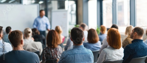 The diverse audience engaged in a professional presentation during a corporate seminar.