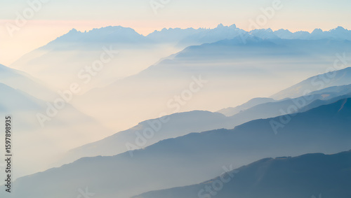 Misty mountain layers at dawn mountains sunrise