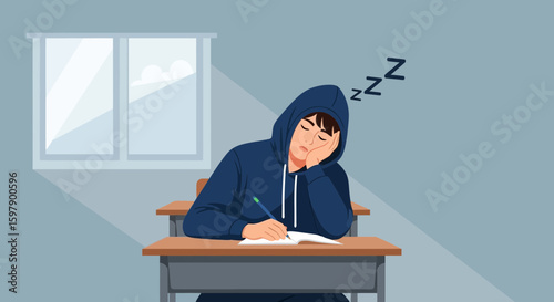 Tired Student Sleeping At The Desk In Classroom During Lesson Time