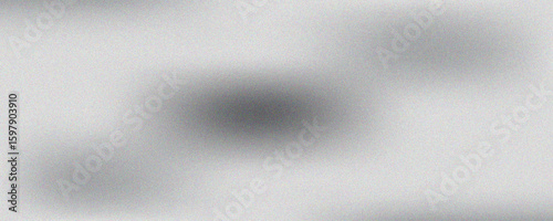 Silver foil background with a grainy texture. Chrome gradient surface with a slight gloss. gray aluminum sheet with reflections.