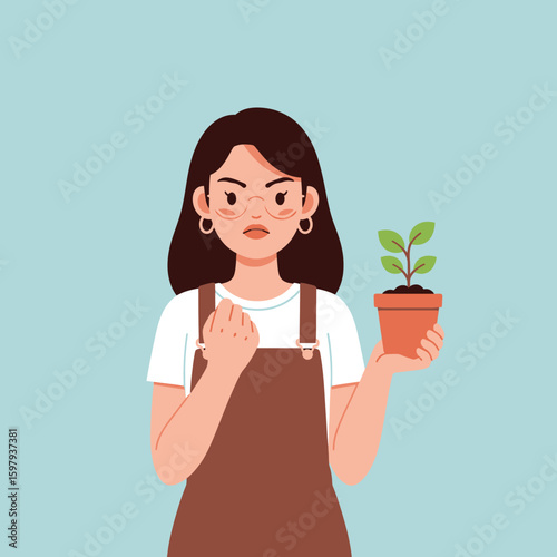 Woman with a stern expression holds a potted plant, showing a clenched fist gesture, against a light blue background.