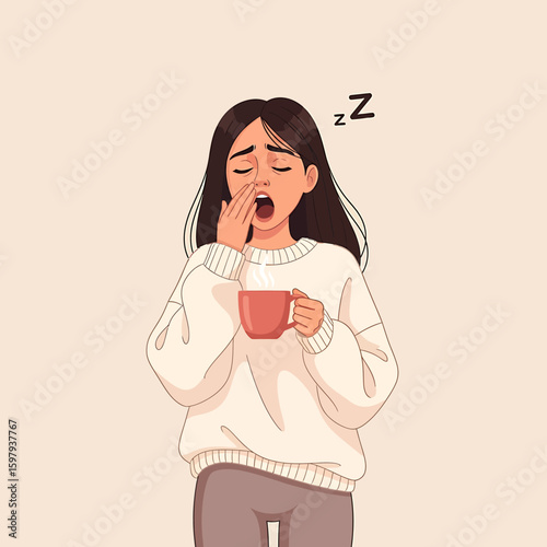 A tired woman in a sweater yawns, covering her mouth with her hand, while holding a steaming mug.