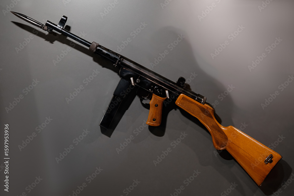 Fototapeta premium Classic Military Submachine Gun on Display with Mounted Bayonet and Wooden Stock