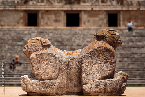 Throne of the two-headed jaguar. In the background is the Palacio del Gobernador or Governor's Palace, in the Ancient Mayan city of Uxmal, Yucatán, Mexico. Horizontal view