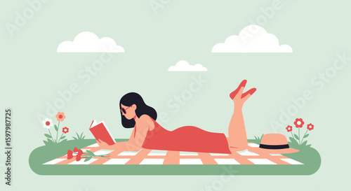 Woman Reading And Relaxing On Picnic Blanket Outdoors In Summer Time