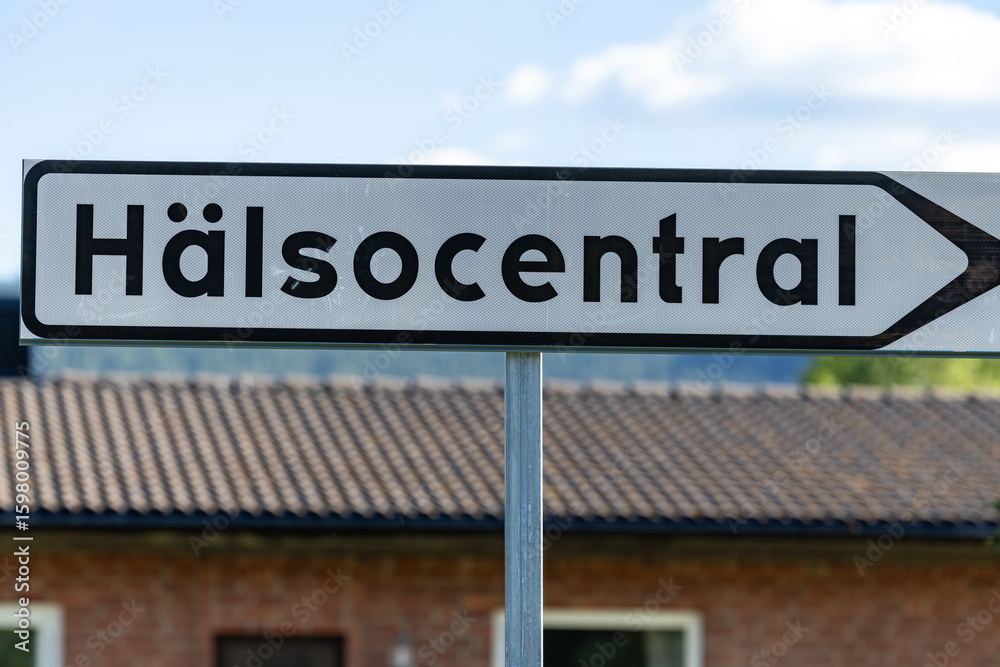 Obraz premium Duved, Sweden A road sign in Swedish points to the regional health center.
