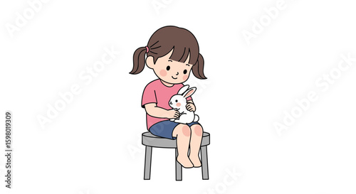 A young girl sits on a small stool holding a cute stuffed rabbit toy in her arms