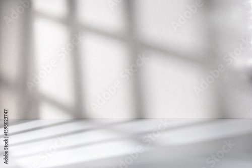 Grey empty room with shadow from window rest on the wall and floor, best for design element background