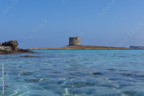 Fototapeta Naklejka Na Ścianę i Meble -  Caletta della Torre beautiful view of ruined tower on la pelosa beach sardinia italy