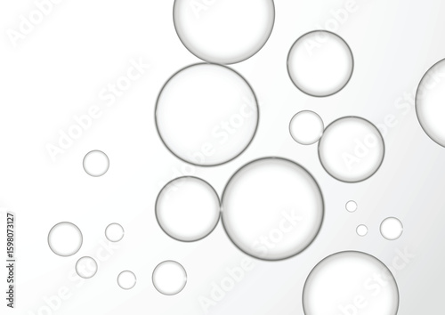 Beautiful clear water bubbles is flying over a grey background. Close up Clear liquid cosmetic product.