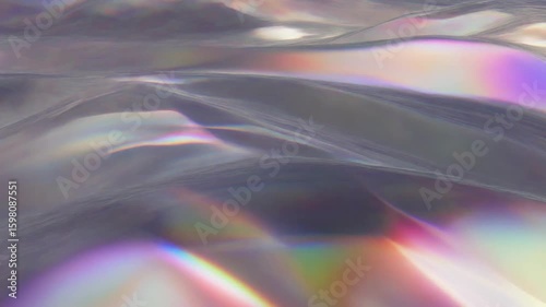 Smooth shimmering prism surface animation with soft waves and rainbow reflections for luxury motion graphics and abstract overlays