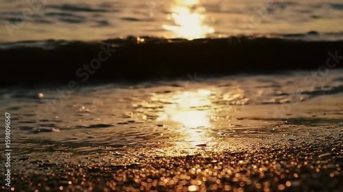 Golden Hour Serenity Waves Gently Washing Over The Sandy Shoreline