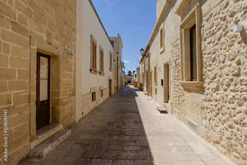 Wallpaper Mural A narrow street in Acaya, a medieval town in the province of Lecce, Italy. Torontodigital.ca