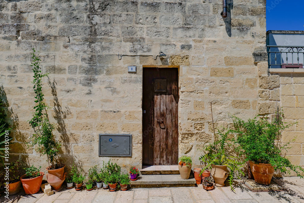 custom made wallpaper toronto digitalThe facade of an old house in Acaya, a medieval town in the province of Lecce, Italy.