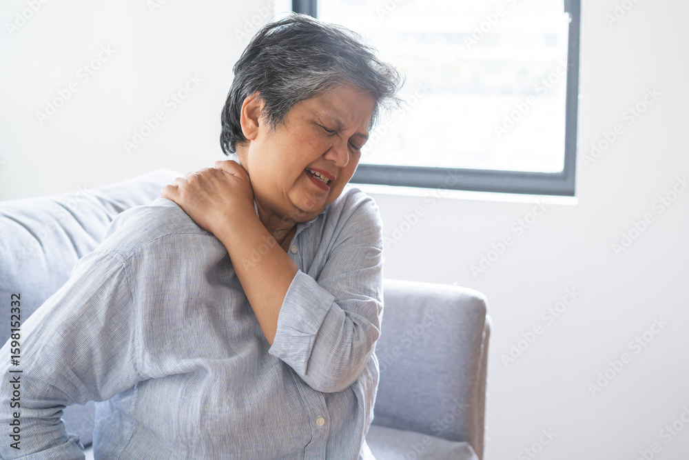 Φωτογραφία Pain body muscles stiff problem, suffer asian senior woman painful, older hand holding neck ache and aged holding massaging rubbing body, injury hurt,sore sitting on sofa at home