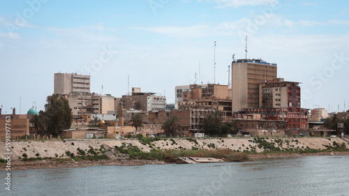 Photos Baghdad city view along the river showcasing urban life and architecture