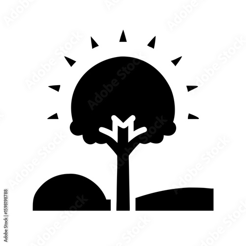 Tree Silhouette Against Glowing Sunset Sky
