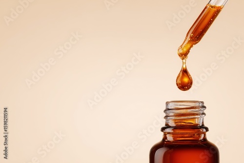 Natural grape seed extract background. Grape Seed Extract in Dropper Bottle with Liquid Droplet Hanging from Pipette in Soft Focus Background