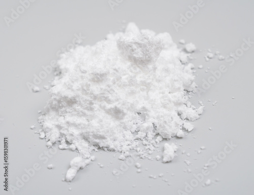 Creatine Powder on light grey background