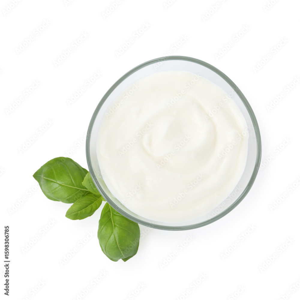 Tasty yoghurt in bowl and basil isolated on white, top view Tasty yoghurt in bowl and basil isolated on white, top view