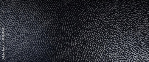 Deep black, textured leather with subtly repeating industrial rivets,  design,  studio