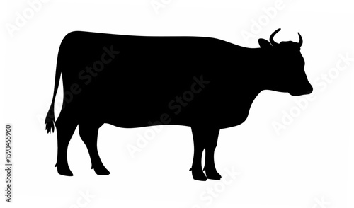 Silhouette of a cow standing in profile with horns and a tail against a white background image view