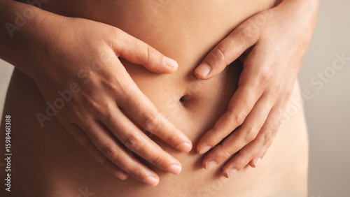 Body care, pregnancy or diet concept 