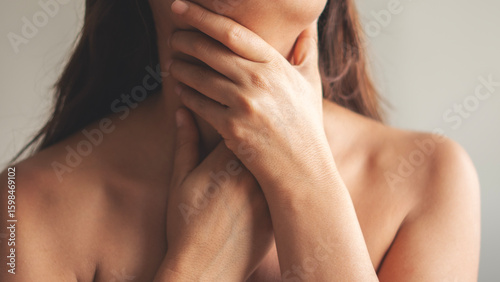 A young woman with a sore throat