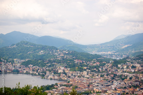 City view with lake and mountains in the background.