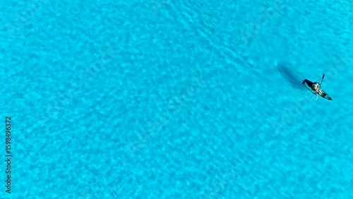 A blue water surface with ripples